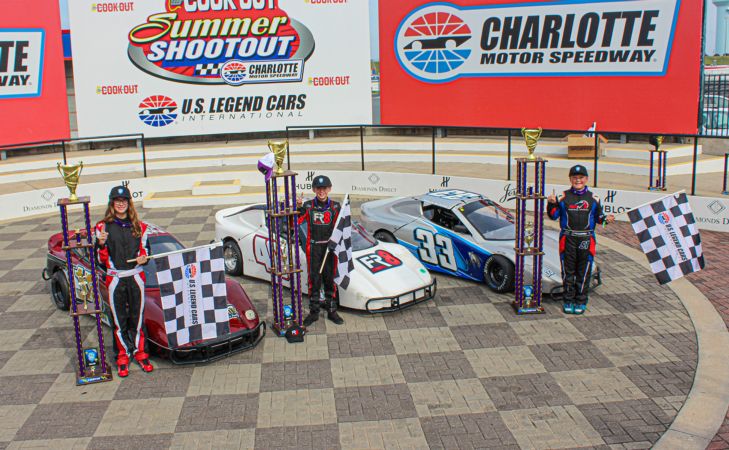 Alison Johnson, Lane Christensen, and Roman Petrino stand by their winning cars with their trophies in Charlotte Motor Speedway victory lane.