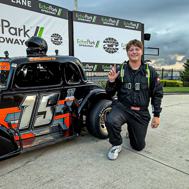 Bryce Sanders next to his championship winning Legend Car at EchoPark Speedway.
