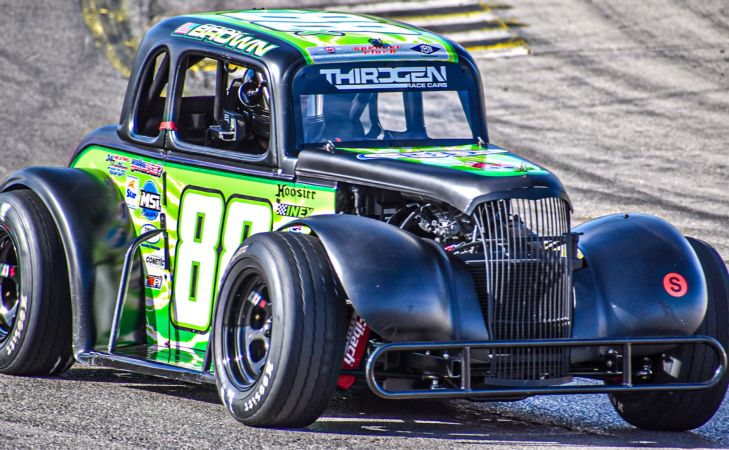 Cody Brown driving his black and green Legend Car during the 2022 Asphalt Nationals at The Bullring at Las Vegas Motor Speedway