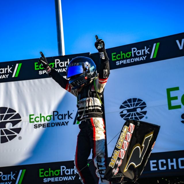 Casen Tate celebrates his Bandits victory on Thursday in EchoPark Speedway victory lane.