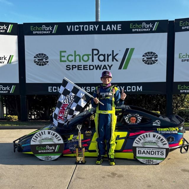 Evan Johnson stands in EchoPark Speedway victory lane after his win in Round 5 of Thursday Thunder.