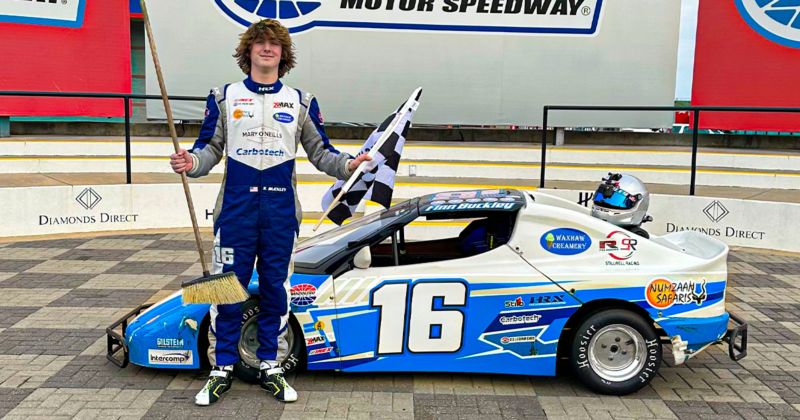 Finn Buckley stands in Charlotte Motor Speedway followin his Round 6 victory at Winter Heat 2024, after sweeping the six-race series in the Outlaws Division.