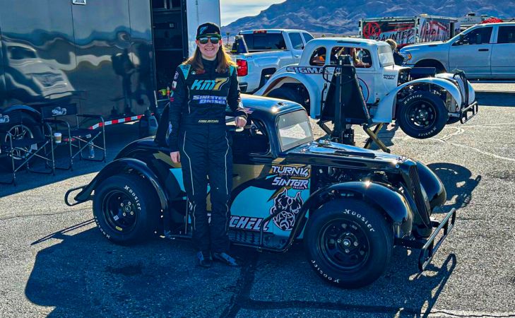 Kenna Mitchell standing next to her Legend Car at Las Vegas Motor Speedway's outfield course before the Silver State Road Course Series.