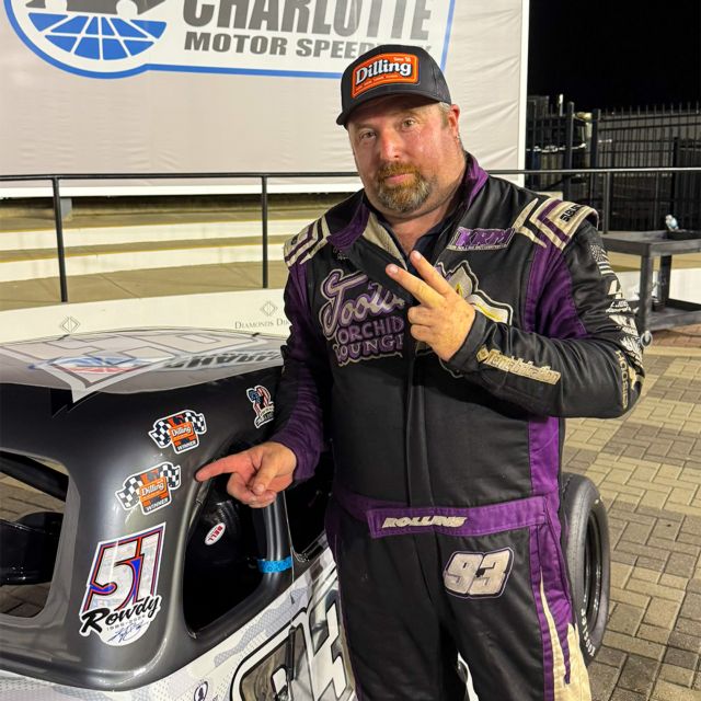 Rollins stands next to his Legend Car in Charlotte Motor Speedway victory lane after winning in the Cook Out Summer Shootout.