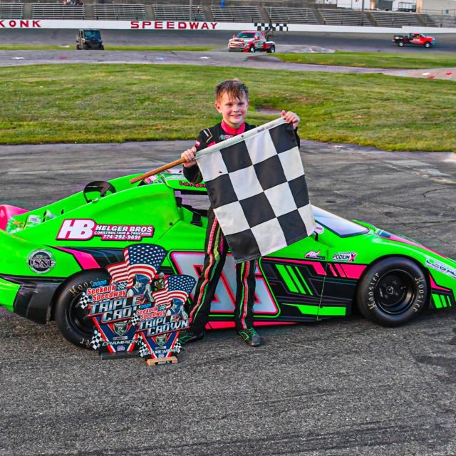 Landon Solomito stands by his Bandolero after winning at Seekonk Speedway.