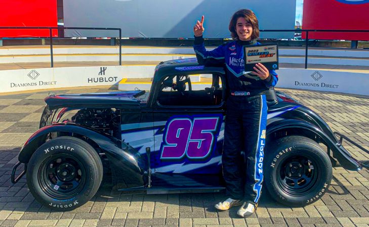 London McKenzie stands in Charlotte Motor Speedway victory lane after winning the sixth Winter Heat round in 2023.