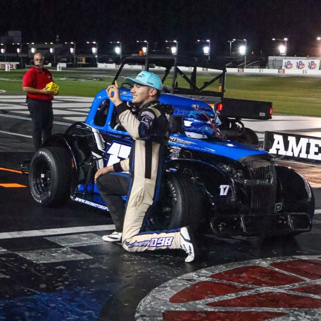 Ben Morabito by his winning Legend Car on Tuesday at Charlotte Motor Speedway.