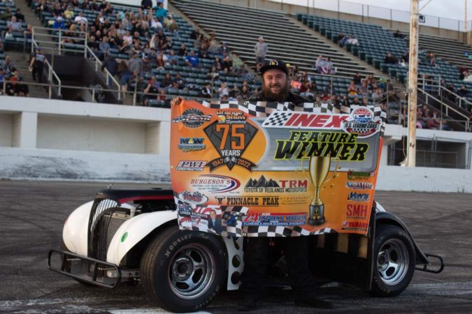 Tyler Hicks celebrating a victory at Orange Show Speedway