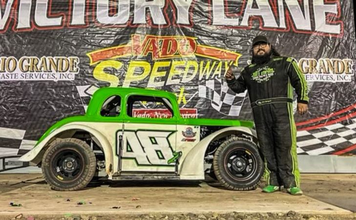 Zach Rodriguez standing in Vado Speedway Victory lane