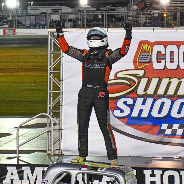 Spencer Bradshaw climbed on top of his Legend Car after his late-race pass for the lead and victory. 