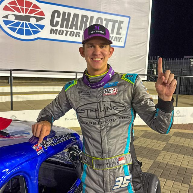 Preston Wrisley stands in Charlotte Motor Speedway victory lane after his first career Summer Shootout victory.